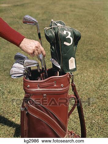 Stock Photograph - 1960S Golf Clubs Golfer'S Hand Making Selection. Fotosearch