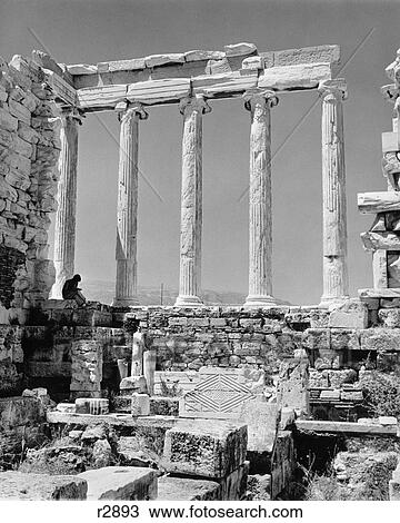 Stock Image - 1960S Greek Columns Architecture Ruins Classic Tourist Person Reading Book Before Restoration Parthenon Athens Acropolis. Fotosearch