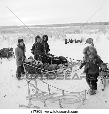 1960S Group Of Eskimo Children Dressed In Fur Parkers On The Frozen Tundra With Their Sleds View Large Photo Image Stock Photo - 1960S Group Of Eskimo Children Dressed In Fur Parkers On The Frozen Tundra With Their Sleds. Fotosearch