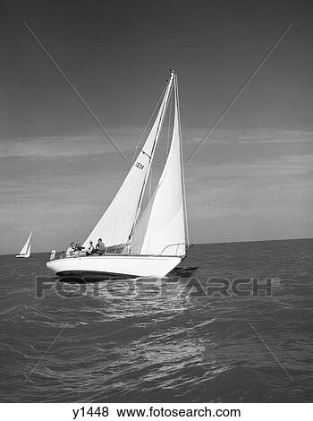 1960S Group Of Five Men Sitting On Large Sailboat In Middle Of Ocean View Large Photo Image Stock Photo - 1960S Group Of Five Men Sitting On Large Sailboat In Middle Of Ocean . Fotosearch