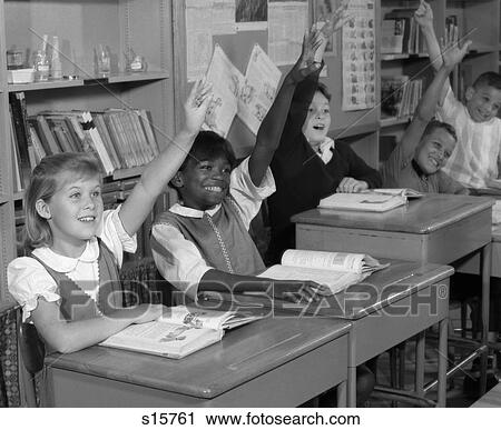 1960S Group Of Grade School Children At Row Of Desks Eagerly Raising Hands View Large Photo Image Stock Image - 1960S Group Of Grade School Children At Row Of Desks Eagerly Raising Hands . Fotosearch