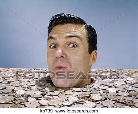 1960S Head Of Man Protruding From Large Pile Of Coins Money Currency Symbolic View Large Photo Image Stock Photo - 1960S Head Of Man Protruding From Large Pile Of Coins Money Currency Symbolic. Fotosearch