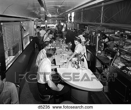 1960S Interior Of A Diner With Customers Seated At Counter & Waitresses Serving Them I View Large Photo Image Stock Photography - 1960S Interior Of A Diner With Customers Seated At Counter & Waitresses Serving Them I . Fotosearch
