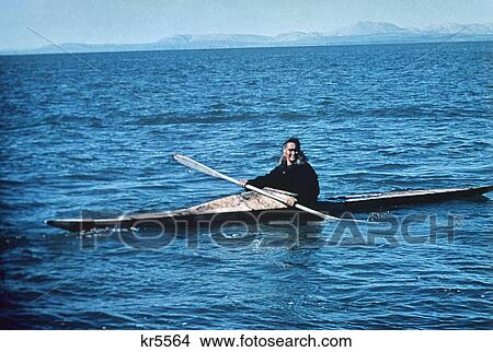 Picture - 1960S Inuit Man Eskimo Skin Kayak Paddle Arctic Ocean Kotzebue Alaska Hunting. Fotosearch