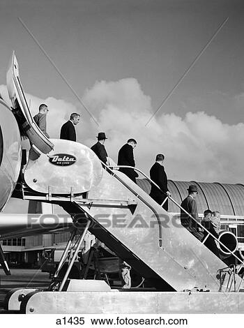 Stock Photography - 1960S Line Of Businessmen Walking Down Stairway Off Of Jet . Fotosearch