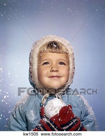 1960'S Little Girl Holding Snow Ball Looking Up At Sky Smiling Red Mittens White Knit Hat Blue Jacket Retro View Large Photo Image Stock Photography - 1960'S Little Girl Holding Snow Ball Looking Up At Sky Smiling Red Mittens White Knit Hat Blue Jacket Retro . Fotosearch