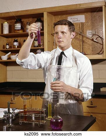 1960S Man College Student In Chemistry Laboratory Looking At Solution In Vial Experiment Learn One Observe Test View Large Photo Image Stock Photography - 1960S Man College Student In Chemistry Laboratory Looking At Solution In Vial Experiment Learn One Observe Test. Fotosearch