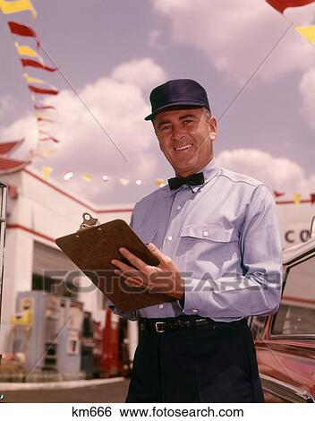 1960S Man Gas Service Station Mechanic Holding Check List On Clipboard Blue Uniform Hat Black Bow Tie Smiling Retro View Large Photo Image Stock Photograph - 1960S Man Gas Service Station Mechanic Holding Check List On Clipboard Blue Uniform Hat Black Bow Tie Smiling Retro . Fotosearch