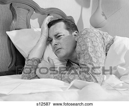 1960S Man In Bed Lying On Side Awake Unable To Sleep Stressed Facial Expression Insomnia Pajamas Retro Vintage View Large Photo Image Stock Photo - 1960S Man In Bed Lying On Side Awake Unable To Sleep Stressed Facial Expression Insomnia Pajamas Retro Vintage. Fotosearch