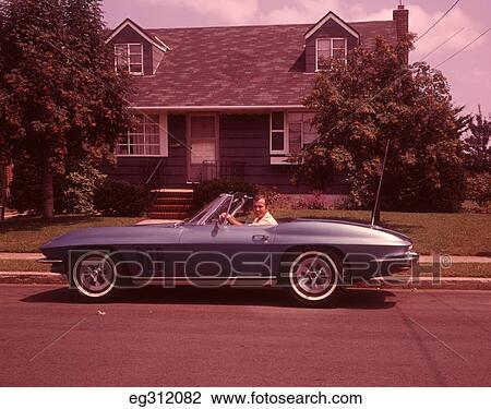 1960S Man In Corvette Convertible In Front Of House View Large Photo Image Stock Image - 1960S Man In Corvette Convertible In Front Of House. Fotosearch