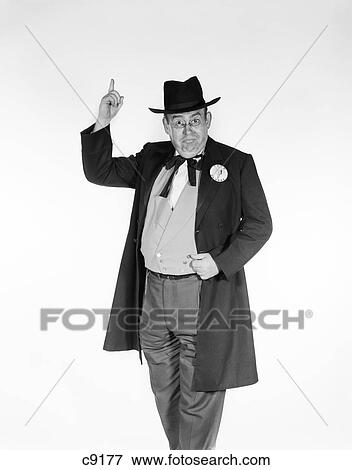 Stock Photo - 1960S Man In Old-Time Politician Costume Wearing Candidate'S Button Pointing Index Finger In Air . Fotosearch