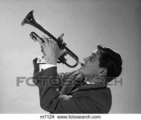 1960S Man Musician Playing Trumpet Tilt Head Back Horn Up Musical Brass Wind Instrument Jazz Blow Breath Perform Solo Retro View Large Photo Image Picture - 1960S Man Musician Playing Trumpet Tilt Head Back Horn Up Musical Brass Wind Instrument Jazz Blow Breath Perform Solo Retro. Fotosearch