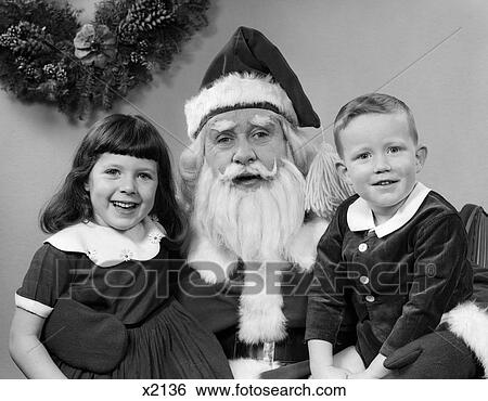 1960S Man Santa Claus Posing With Young Boy And Girl On Lap Smiling Indoor View Large Photo Image Stock Photograph - 1960S Man Santa Claus Posing With Young Boy And Girl On Lap Smiling Indoor . Fotosearch