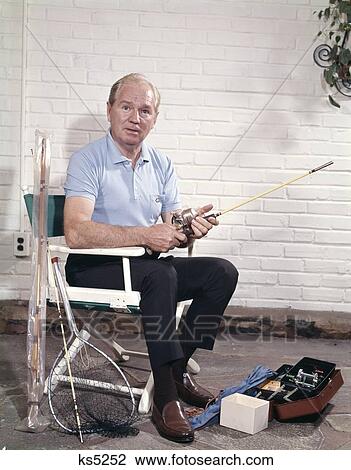 1960S Man Sitting Chair Holding Fishing Rod Tackle Bo Net View Large Photo Image Stock Image - 1960S Man Sitting Chair Holding Fishing Rod Tackle Bo Net. Fotosearch