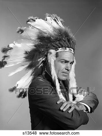 1960S Man Smug Facail Expression Arms Crossed Wearing Native American Indian Headdress View Large Photo Image Stock Photo - 1960S Man Smug Facail Expression Arms Crossed Wearing Native American Indian Headdress. Fotosearch