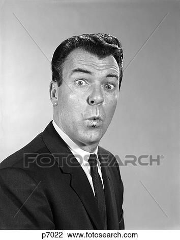 1960S Man Suit Tie Making Funny Face Facial Expression Lips Pursed Eyes Wide View Large Photo Image Stock Image - 1960S Man Suit Tie Making Funny Face Facial Expression Lips Pursed Eyes Wide . Fotosearch