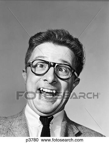 1960S Man Wearing Black Plastic Frame Eye Glasses Making A Goofy Expression View Large Photo Image Stock Image - 1960S Man Wearing Black Plastic Frame Eye Glasses Making A Goofy Expression . Fotosearch