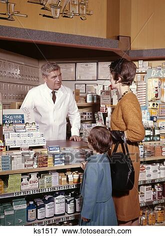 1960S Mother And Daughter In Pharmacy Talking To Druggist Three Man Woman Girl Medicine Vitamin View Large Photo Image Stock Photo - 1960S Mother And Daughter In Pharmacy Talking To Druggist Three Man Woman Girl Medicine Vitamin. Fotosearch