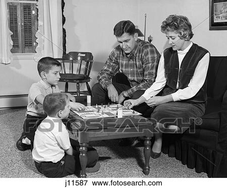 1960S Mother Father Children 2 Kids Boys Playing Board Game Parcheesi Family Fun Social Living Room Coffee Table 1960 Rrr Retro View Large Photo Image Stock Photo - 1960S Mother Father Children 2 Kids Boys Playing Board Game Parcheesi Family Fun Social Living Room Coffee Table 1960 Rrr Retro. Fotosearch