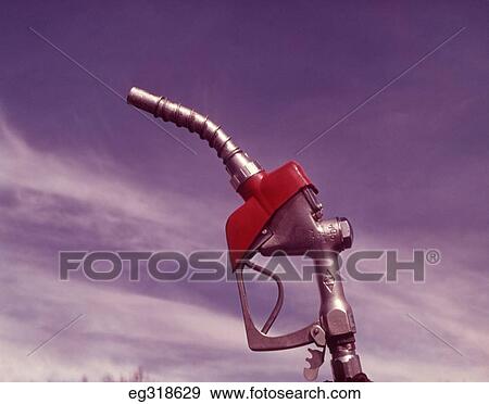Stock Photo - 1960S Nozzle Handle Of Gasoline Pump With Blue Sky Background. Fotosearch