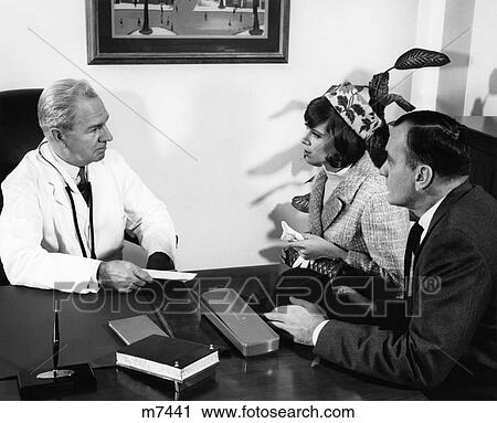 1960S Older Man Doctor In Office Having Discussion With Husband And Wife Indoor View Large Photo Image Stock Image - 1960S Older Man Doctor In Office Having Discussion With Husband And Wife Indoor . Fotosearch
