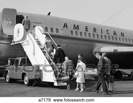 1960S Passengers Boarding American Airlines Astrojet By Way Of Short Stairway Raised From Bed Of Pickup Truck View Large Photo Image Stock Photo - 1960S Passengers Boarding American Airlines Astrojet By Way Of Short Stairway Raised From Bed Of Pickup Truck . Fotosearch