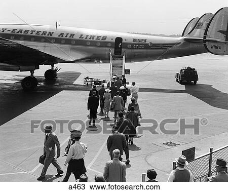 1960S Passengers Boarding Prop Plane Ladder Tarmac Travel Vacation Airport Eastern Air Lines View Large Photo Image Stock Image - 1960S Passengers Boarding Prop Plane Ladder Tarmac Travel Vacation Airport Eastern Air Lines . Fotosearch