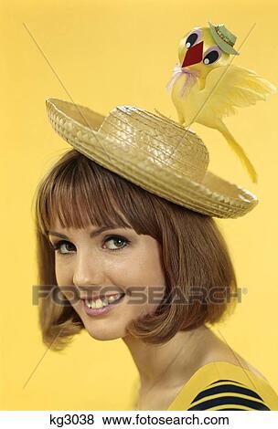 1960S Portrait Brunette Youn Woman Wearing Silly Straw Hat Easter Bonnet With Toy Chick On Top View Large Photo Image Stock Photo - 1960S Portrait Brunette Youn Woman Wearing Silly Straw Hat Easter Bonnet With Toy Chick On Top . Fotosearch