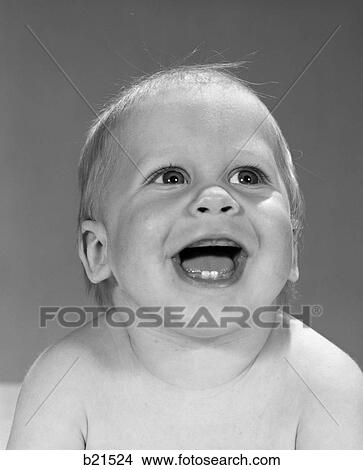 Picture - 1960S Portrait Close-Up Of Smiling Baby Boy With First 2 Teeth In Bottom Gums Showing . Fotosearch