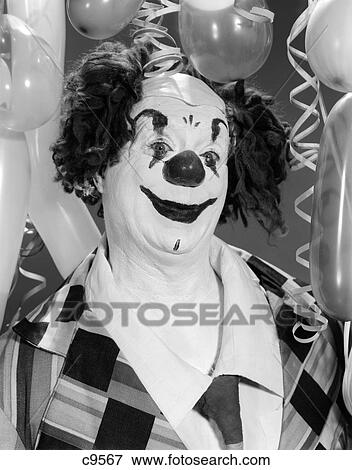 1960S Portrait Clown In Full Costume Surrounded By Balloons View Large Photo Image Stock Photo - 1960S Portrait Clown In Full Costume Surrounded By Balloons . Fotosearch