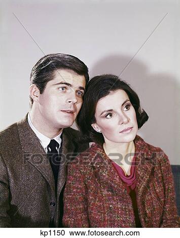 1960S Portrait Couple Man Woman Looking To Side Serious Expression Retro View Large Photo Image Stock Image - 1960S Portrait Couple Man Woman Looking To Side Serious Expression Retro . Fotosearch