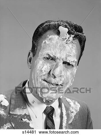 Stock Image - 1960S Portrait Man Covered In Meringue Shaving Cream Pie In The Face Funny Angry Expression . Fotosearch