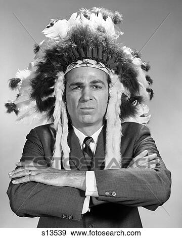 1960S Portrait Man Wearing Indian Chief Feathered Headdress View Large Photo Image Stock Photo - 1960S Portrait Man Wearing Indian Chief Feathered Headdress . Fotosearch