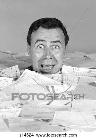 1960S Portrait Of Alarmed Man Head Being Buried By Bills View Large Photo Image Picture - 1960S Portrait Of Alarmed Man Head Being Buried By Bills . Fotosearch