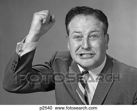 1960S Portrait Of Angry Man Raising Fist At Camera View Large Photo Image Stock Image - 1960S Portrait Of Angry Man Raising Fist At Camera . Fotosearch