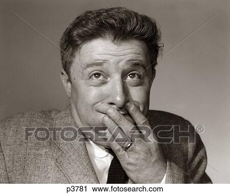 Stock Image - 1960S Portrait Of Man With Hands On Face Eyes Bugged Looking Sick . Fotosearch
