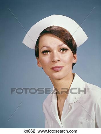 1960S Portrait Of Medical Nurse Wearing Cap And White Uniform Registered Practical Profession View Large Photo Image Stock Image - 1960S Portrait Of Medical Nurse Wearing Cap And White Uniform Registered Practical Profession . Fotosearch