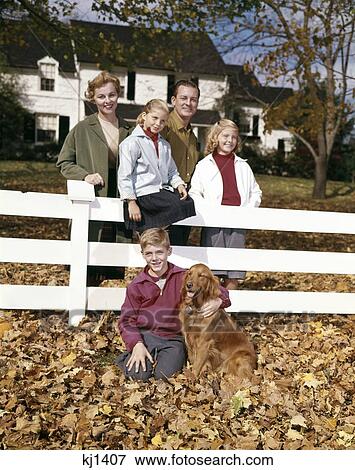 1960S Portrait Of Parents With Son And Two Daughters And Dog At White Fence Autumn Golden Retriever Seasons View Large Photo Image Stock Photo - 1960S Portrait Of Parents With Son And Two Daughters And Dog At White Fence Autumn Golden Retriever Seasons. Fotosearch