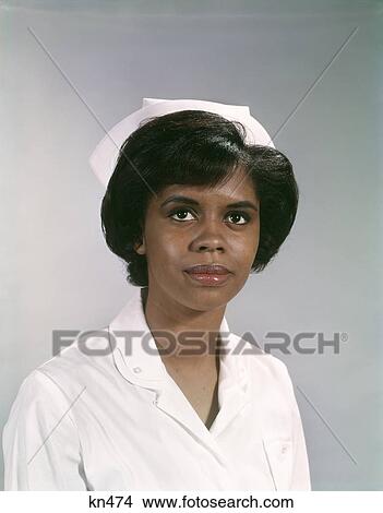 1960S Portrait Serious Amfrican-American Nurse In Uniform View Large Photo Image Picture - 1960S Portrait Serious Amfrican-American Nurse In Uniform . Fotosearch