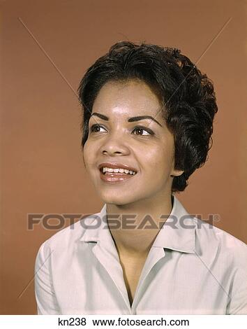 1960S Portrait Smiling African-American Woman Looking To Side View Large Photo Image Stock Photo - 1960S Portrait Smiling African-American Woman Looking To Side . Fotosearch