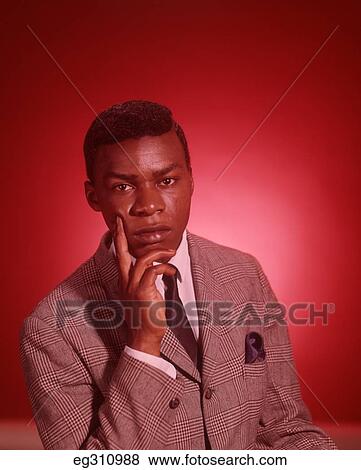 1960S Portrait Thoughtful African-American Young Man Hand To Chin View Large Photo Image Stock Photo - 1960S Portrait Thoughtful African-American Young Man Hand To Chin. Fotosearch
