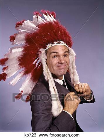 1960S Proud Looking Man In Commercial Costume Native American Feather Headdress Studio View Large Photo Image Stock Image - 1960S Proud Looking Man In Commercial Costume Native American Feather Headdress Studio . Fotosearch