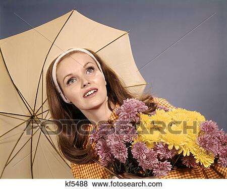 1960S Retro Woman Red Hair Holding Bunch Of Flowers Under Umbrella View Large Photo Image Stock Photo - 1960S Retro Woman Red Hair Holding Bunch Of Flowers Under Umbrella. Fotosearch