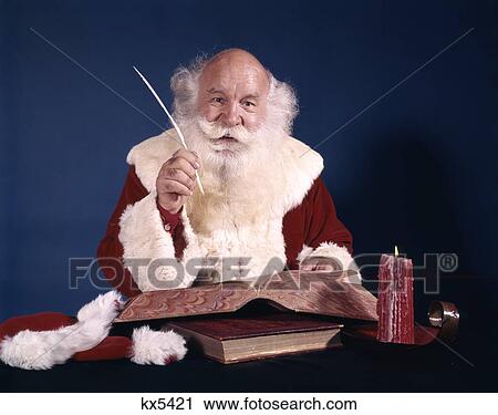1960S Santa Sitting At Desk With Open Book Making A List With Quill Pen View Large Photo Image Stock Image - 1960S Santa Sitting At Desk With Open Book Making A List With Quill Pen. Fotosearch