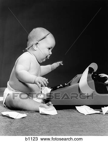 1960S Side View Of Chubby Baby Seated Behind Adding Machine With Pencil Behind Ear & Tape Scattered On Floor View Large Photo Image Stock Image - 1960S Side View Of Chubby Baby Seated Behind Adding Machine With Pencil Behind Ear & Tape Scattered On Floor . Fotosearch