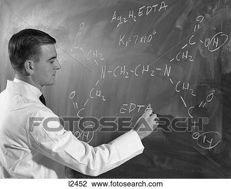 1960S Side View Of Man In Lab Coat Writing Out Formula Of Chemical Compound On Blackboard View Large Photo Image Stock Image - 1960S Side View Of Man In Lab Coat Writing Out Formula Of Chemical Compound On Blackboard . Fotosearch