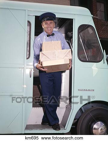 1960S Smiling Delivery Man Carrying Pile Of Packages Stepping At Doorway Of Step Van Driver Occupation View Large Photo Image Stock Photography - 1960S Smiling Delivery Man Carrying Pile Of Packages Stepping At Doorway Of Step Van Driver Occupation . Fotosearch