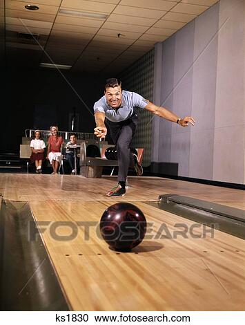 1960S Smiling Man In Good Form Releasing Bowling Ball Down Lane Wife Woman 2 Kids Look On Recreation Family Fun Alley View Large Photo Image Stock Image - 1960S Smiling Man In Good Form Releasing Bowling Ball Down Lane Wife Woman 2 Kids Look On Recreation Family Fun Alley. Fotosearch