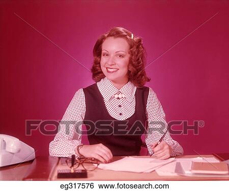 1960S Smiling Secretarial Woman At Desk View Large Photo Image Stock Photograph - 1960S Smiling Secretarial Woman At Desk. Fotosearch