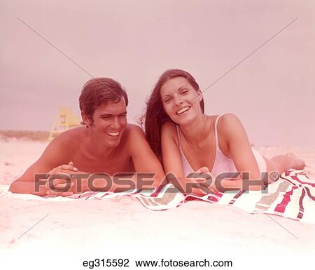 1960S Smiling Young Couple At Beach View Large Photo Image Stock Image - 1960S Smiling Young Couple At Beach. Fotosearch